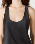Discover luxury with the Anaiis Silk Tank in black from AOCO. Crafted from premium silk, this chic and versatile camisole offers a flawless drape for any occasion. And Racerback feature.
