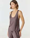 Discover luxury with the Anaiis Silk Tank from AOCO. Crafted from premium silk, this chic and versatile camisole offers a flawless drape for any occasion. And Racerback feature.