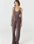 Discover luxury with the Anaiis Silk Tank from AOCO. Crafted from premium silk, this chic and versatile camisole offers a flawless drape for any occasion. And Racerback feature.