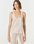 Discover luxury with the Anaiis Silk Tank in champagne cream from AOCO. Crafted from premium silk, this chic and versatile camisole offers a flawless drape for any occasion. And Racerback feature.