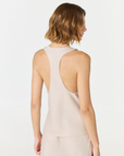 Discover luxury with the Anaiis Silk Tank in champagne cream from AOCO. Crafted from premium silk, this chic and versatile camisole offers a flawless drape for any occasion. And Racerback feature.