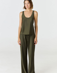 Discover luxury with the Anaiis Silk Tank in olive from AOCO. Crafted from premium silk, this chic and versatile camisole offers a flawless drape for any occasion. And Racerback feature.