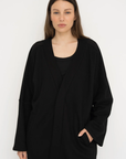 Wrap yourself in comfort with the French Terry Robe Jacket from AOCO. This versatile layer blends robe-like coziness with an everyday stylish jacket design.