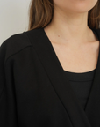 Wrap yourself in comfort with the French Terry Robe Jacket from AOCO. This versatile layer blends robe-like coziness with an everyday stylish jacket design.