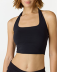 Refresh your summer wardrobe with the Mia Cropped Halter from AOCO. Featuring a chic halter neckline and a flattering cropped fit, it's a warm weather must.