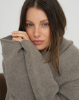 Stay warm and stylish with the Cashmere Wool Blend Cardigan by AOCO. This luxurious, ultra-soft knit sweater provides a cozy, elegant layering essential.