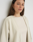 Wrap yourself in comfort with the French Terry Robe Jacket from AOCO. This versatile layer blends robe-like coziness with an everyday stylish jacket design.