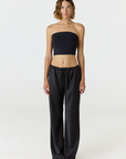 Elevate your warm-weather wardrobe with the Edie Bandeau Top in Black from AOCO. This chic strapless design offers a flattering fit and endless style possibilities.