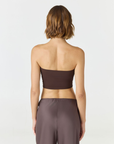 Elevate your warm-weather wardrobe with the Edie Bandeau Top in Espresso from AOCO. This chic strapless design offers a flattering fit and endless style possibilities.