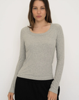 Upgrade your basics with the Long Sleeve Fitted Scoop Neck Top by AOCO. Made from soft, stretchy fabric, this flattering silhouette is a daily essential.