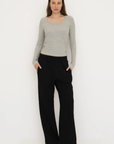 Upgrade your basics with the Long Sleeve Fitted Scoop Neck Top by AOCO. Made from soft, stretchy fabric, this flattering silhouette is a daily essential.