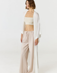 Relax in luxury with the Shura Kaftan from AOCO. This breezy, lightweight resort wear piece features an elegant, relaxed fit perfect for your next getaway.