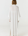 Relax in luxury with the Shura Kaftan from AOCO. This breezy, lightweight resort wear piece features an elegant, relaxed fit perfect for your next getaway.