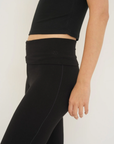 Soft organic cotton fold over leggings in black with a comfortable fold over waistband.
