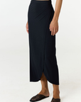 Step into summer with the flowy Soleil Wrap Skirt from AOCO. Featuring a lightweight fabric and an adjustable waist, this piece delivers effortless comfort.