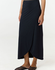 Step into summer with the flowy Soleil Wrap Skirt from AOCO. Featuring a lightweight fabric and an adjustable waist, this piece delivers effortless comfort.