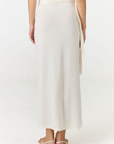 Step into summer with the flowy Soleil Wrap Skirt from AOCO. Featuring a lightweight fabric and an adjustable waist, this piece delivers effortless comfort.