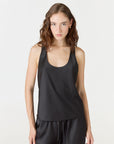 Discover luxury with the Anaiis Silk Tank from AOCO. Crafted from premium silk, this chic and versatile camisole offers a flawless drape for any occasion. And Racerback feature.