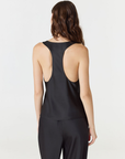 Discover luxury with the Anaiis Silk Tank in black from AOCO. Crafted from premium silk, this chic and versatile camisole offers a flawless drape for any occasion. And Racerback feature.