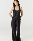 Discover luxury with the Anaiis Silk Tank in black from AOCO. Crafted from premium silk, this chic and versatile camisole offers a flawless drape for any occasion. And Racerback feature.