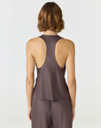 Discover luxury with the Anaiis Silk Tank from AOCO. Crafted from premium silk, this chic and versatile camisole offers a flawless drape for any occasion. And Racerback feature.