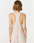 Discover luxury with the Anaiis Silk Tank in champagne cream from AOCO. Crafted from premium silk, this chic and versatile camisole offers a flawless drape for any occasion. And Racerback feature.