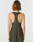Discover luxury with the Anaiis Silk Tank in olive from AOCO. Crafted from premium silk, this chic and versatile camisole offers a flawless drape for any occasion. And Racerback feature.