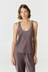 Discover luxury with the Anaiis Silk Tank from AOCO. Crafted from premium silk, this chic and versatile camisole offers a flawless drape for any occasion. And Racerback feature.