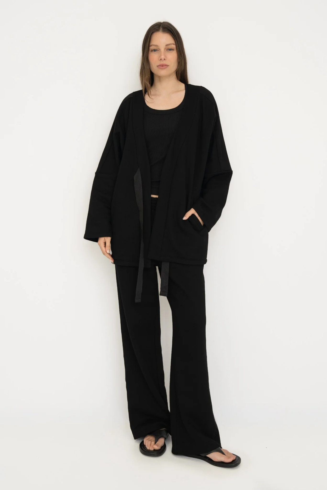 Wrap yourself in comfort with the French Terry Robe Jacket from AOCO. This versatile layer blends robe-like coziness with an everyday stylish jacket design.