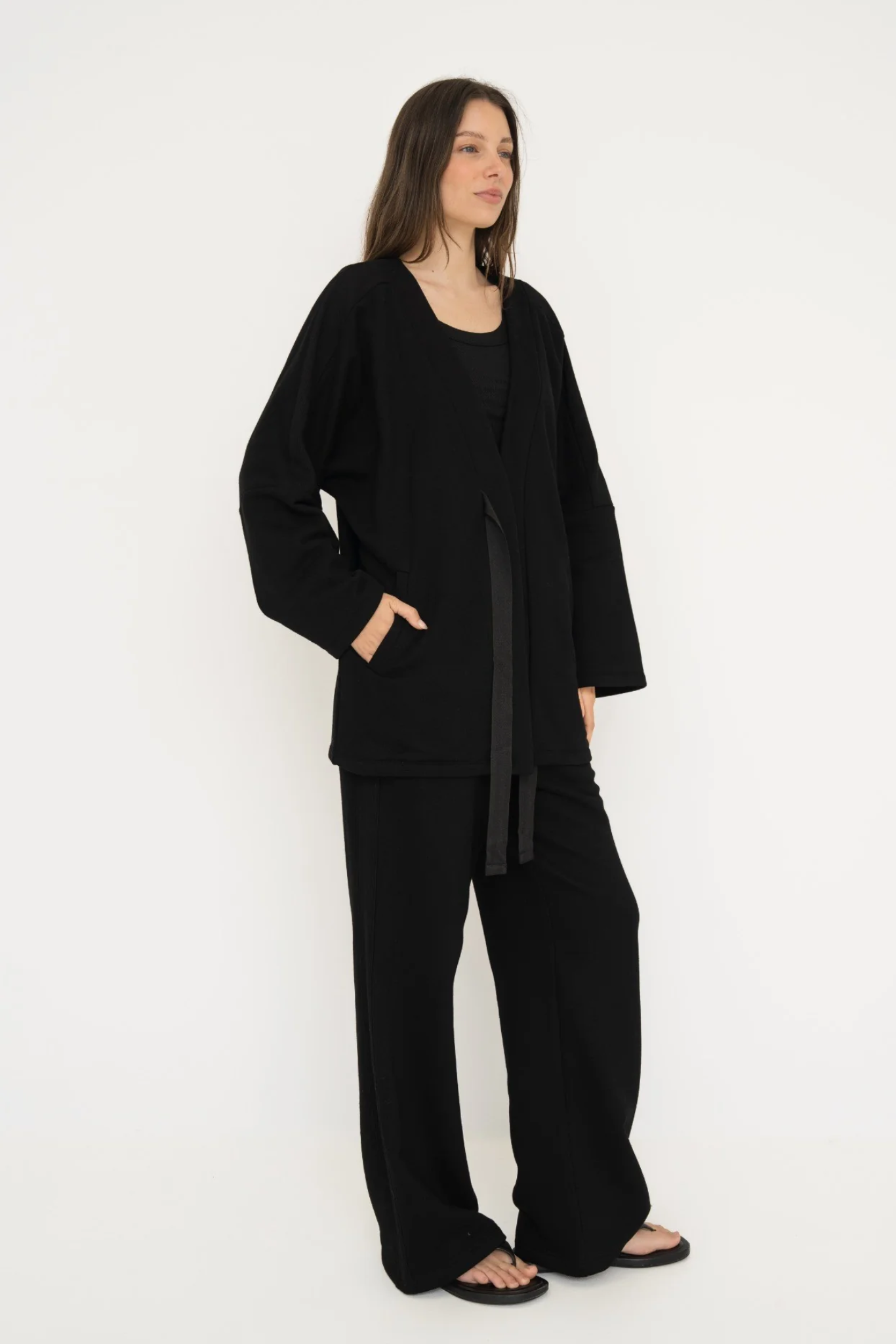 Wrap yourself in comfort with the French Terry Robe Jacket from AOCO. This versatile layer blends robe-like coziness with an everyday stylish jacket design.