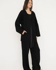 Wrap yourself in comfort with the French Terry Robe Jacket from AOCO. This versatile layer blends robe-like coziness with an everyday stylish jacket design.