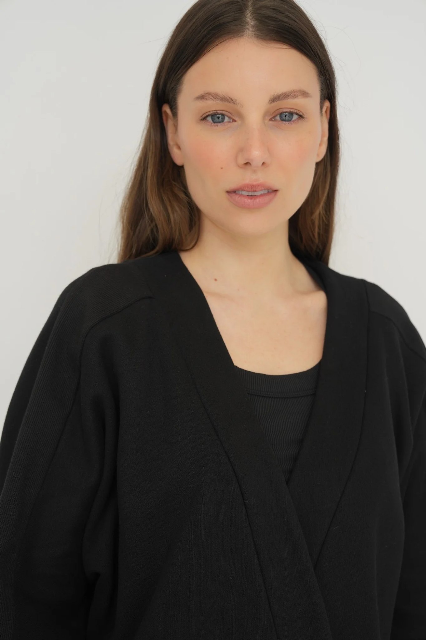 Wrap yourself in comfort with the French Terry Robe Jacket from AOCO. This versatile layer blends robe-like coziness with an everyday stylish jacket design.