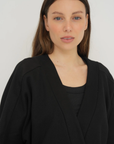 Wrap yourself in comfort with the French Terry Robe Jacket from AOCO. This versatile layer blends robe-like coziness with an everyday stylish jacket design.
