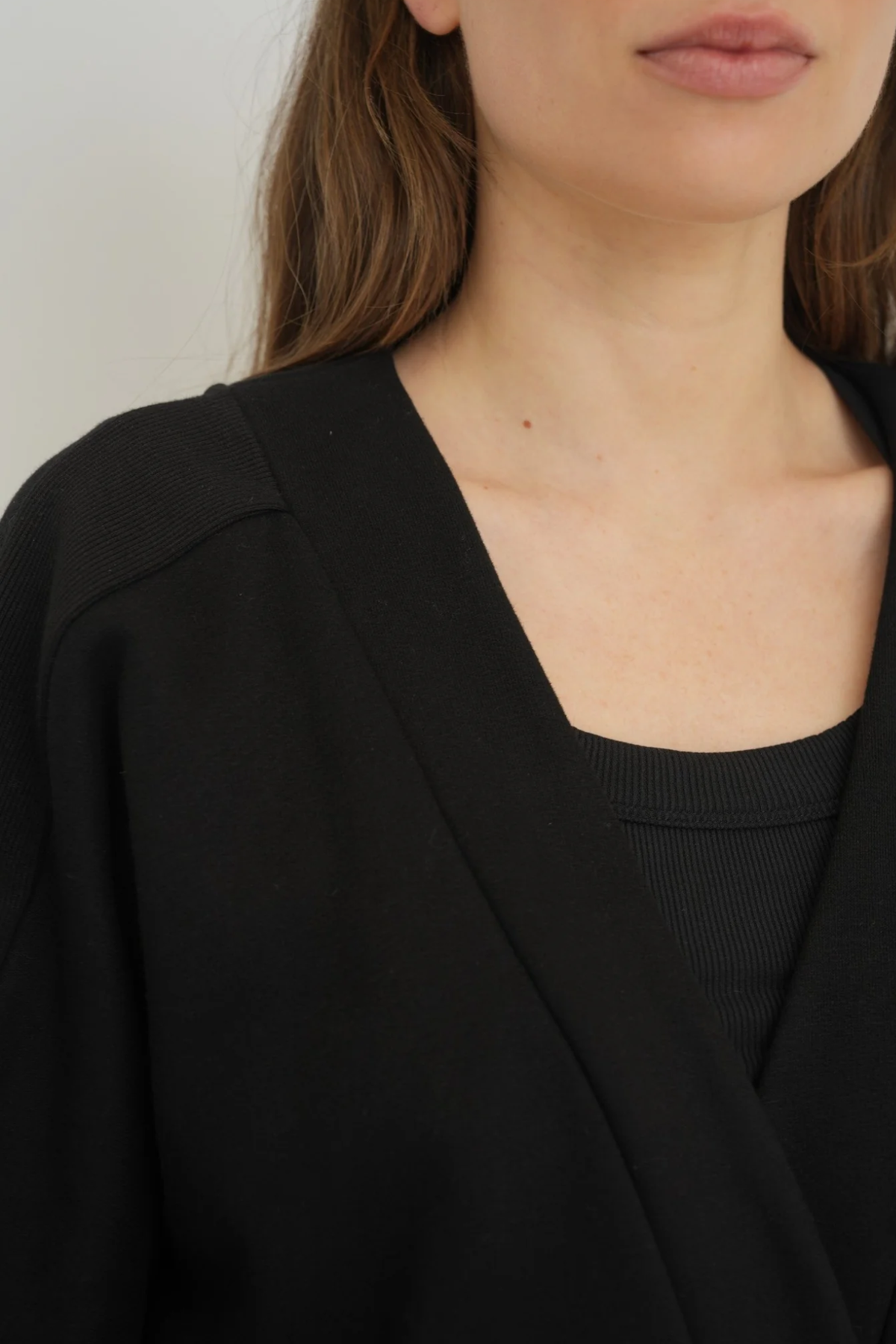 Wrap yourself in comfort with the French Terry Robe Jacket from AOCO. This versatile layer blends robe-like coziness with an everyday stylish jacket design.