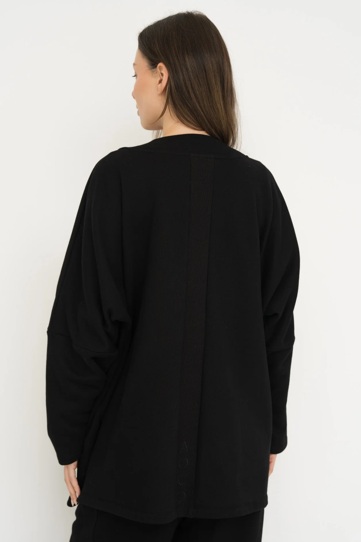 Wrap yourself in comfort with the French Terry Robe Jacket from AOCO. This versatile layer blends robe-like coziness with an everyday stylish jacket design.