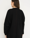 Wrap yourself in comfort with the French Terry Robe Jacket from AOCO. This versatile layer blends robe-like coziness with an everyday stylish jacket design.