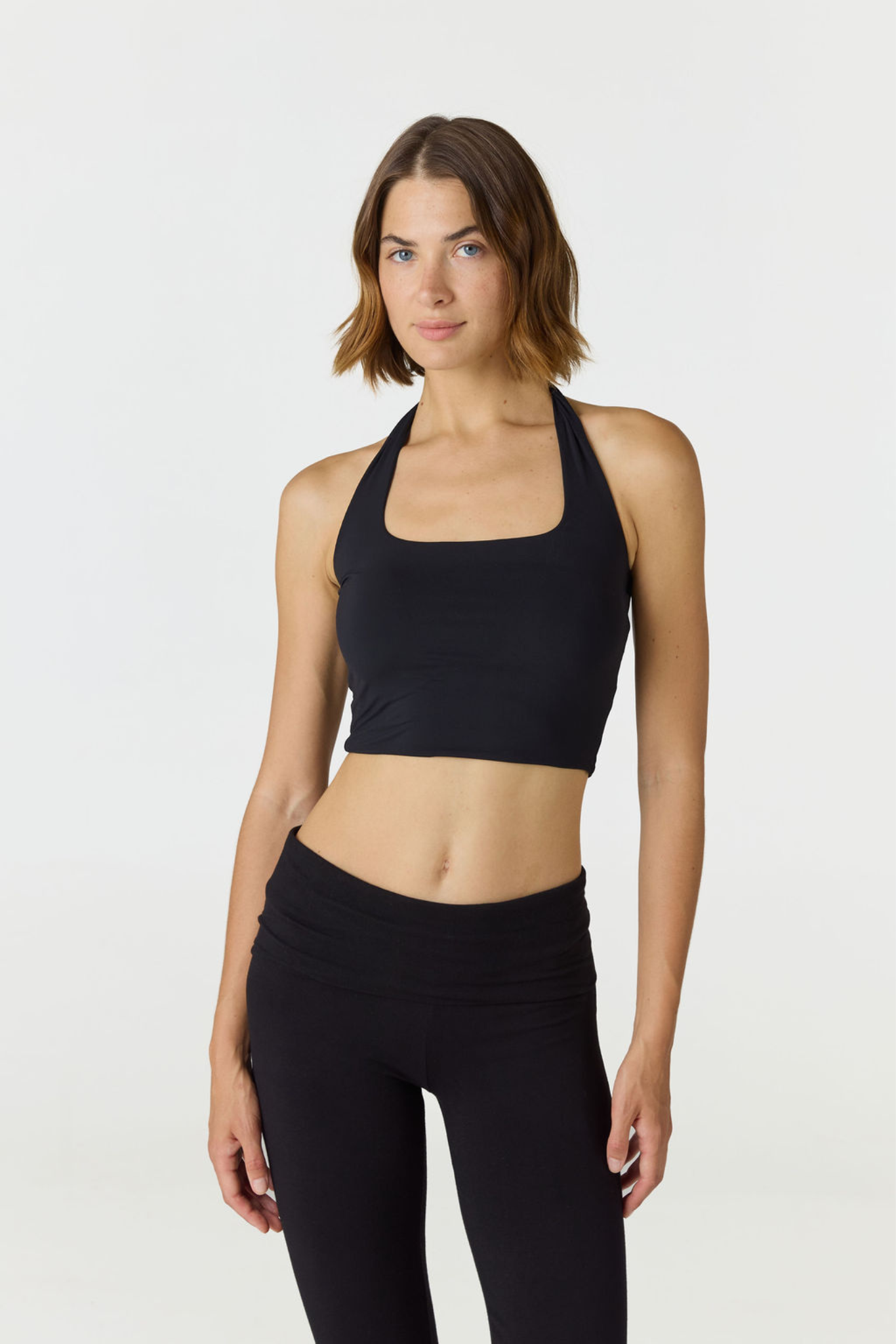 Refresh your summer wardrobe with the Mia Cropped Halter from AOCO. Featuring a chic halter neckline and a flattering cropped fit, it's a warm weather must.