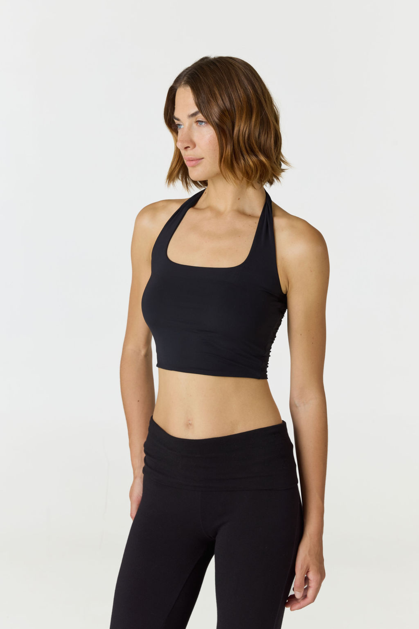 Refresh your summer wardrobe with the Mia Cropped Halter from AOCO. Featuring a chic halter neckline and a flattering cropped fit, it's a warm weather must.