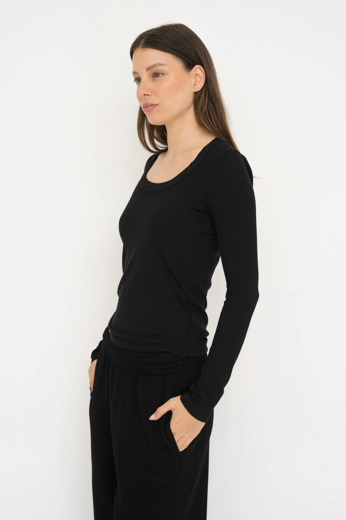 Upgrade your basics with the Long Sleeve Fitted Scoop Neck Top by AOCO. Made from soft, stretchy fabric, this flattering silhouette is a daily essential.