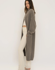 Stay warm and stylish with the Cashmere Wool Blend Cardigan by AOCO. This luxurious, ultra-soft knit sweater provides a cozy, elegant layering essential.