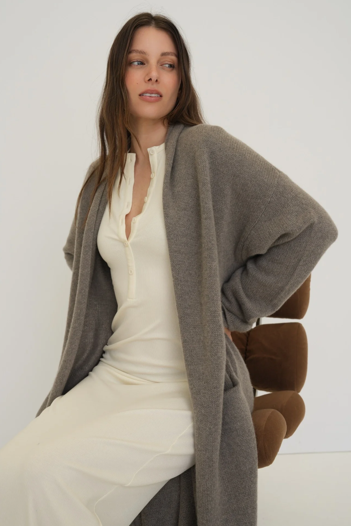 Stay warm and stylish with the Cashmere Wool Blend Cardigan by AOCO. This luxurious, ultra-soft knit sweater provides a cozy, elegant layering essential.