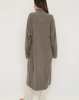 Stay warm and stylish with the Cashmere Wool Blend Cardigan by AOCO. This luxurious, ultra-soft knit sweater provides a cozy, elegant layering essential.