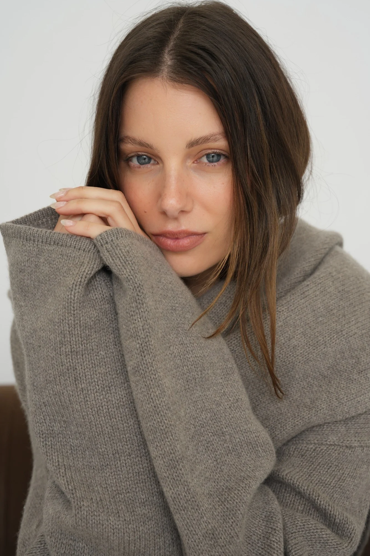 Stay warm and stylish with the Cashmere Wool Blend Cardigan by AOCO. This luxurious, ultra-soft knit sweater provides a cozy, elegant layering essential.