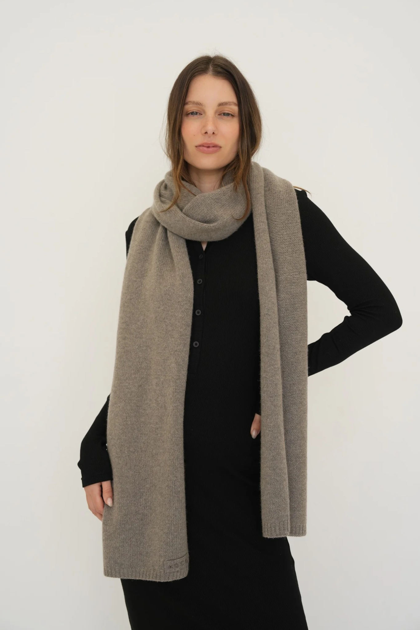 Stay warm with the Cashmere Wool Blend Scarf from AOCO. Crafted from ultra-soft fibers, this elegant accessory is an essential cold weather staple.