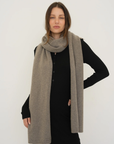 Stay warm with the Cashmere Wool Blend Scarf from AOCO. Crafted from ultra-soft fibers, this elegant accessory is an essential cold weather staple.
