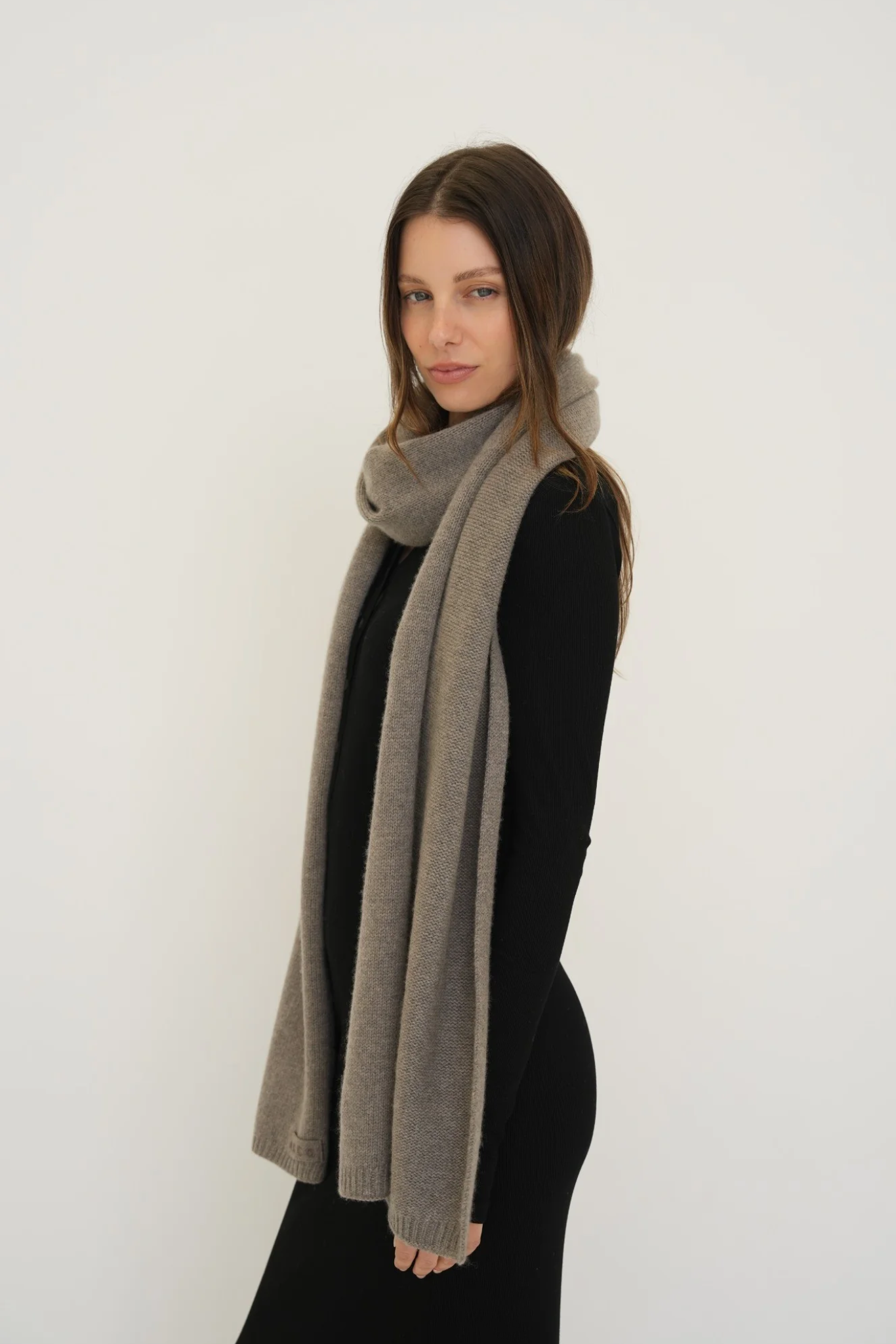 Stay warm with the Cashmere Wool Blend Scarf from AOCO. Crafted from ultra-soft fibers, this elegant accessory is an essential cold weather staple.
