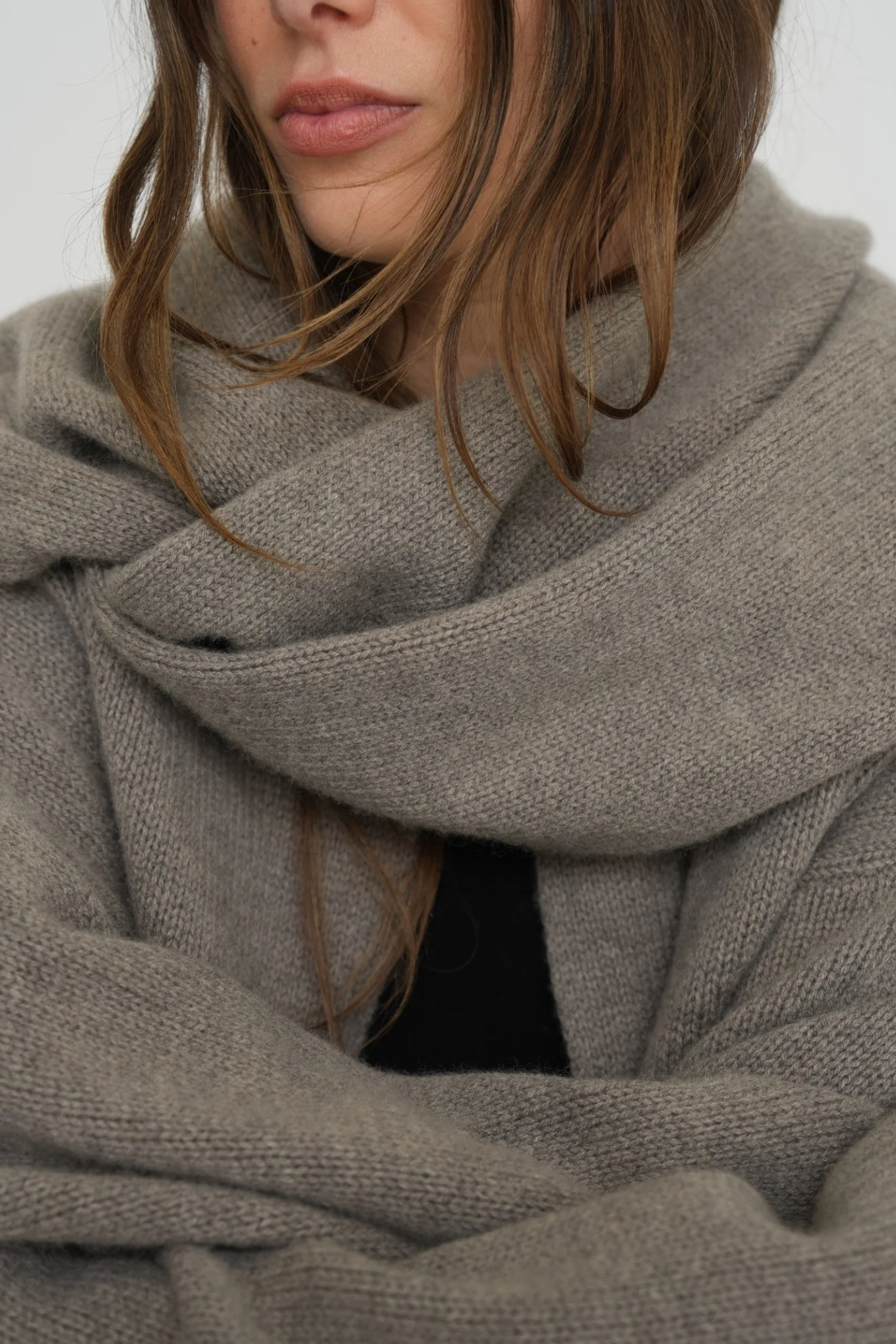 Stay warm with the Cashmere Wool Blend Scarf from AOCO. Crafted from ultra-soft fibers, this elegant accessory is an essential cold weather staple.