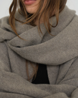 Stay warm with the Cashmere Wool Blend Scarf from AOCO. Crafted from ultra-soft fibers, this elegant accessory is an essential cold weather staple.