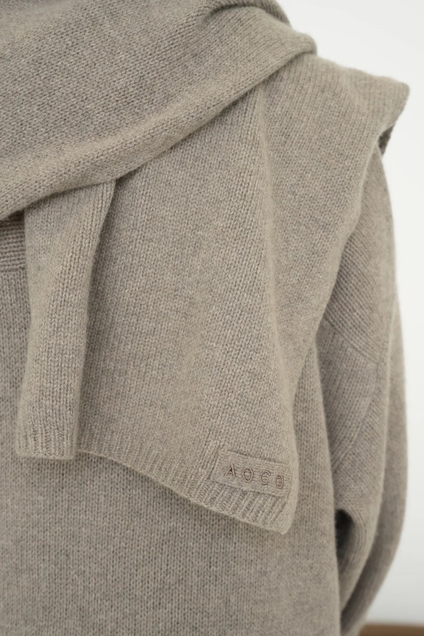 Stay warm with the Cashmere Wool Blend Scarf from AOCO. Crafted from ultra-soft fibers, this elegant accessory is an essential cold weather staple.