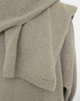 Stay warm with the Cashmere Wool Blend Scarf from AOCO. Crafted from ultra-soft fibers, this elegant accessory is an essential cold weather staple.